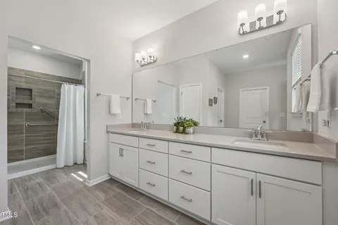 a bed room with a bed and a window