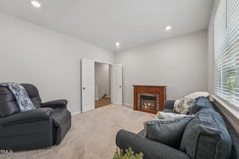 a bedroom with a bed and a ceiling fan