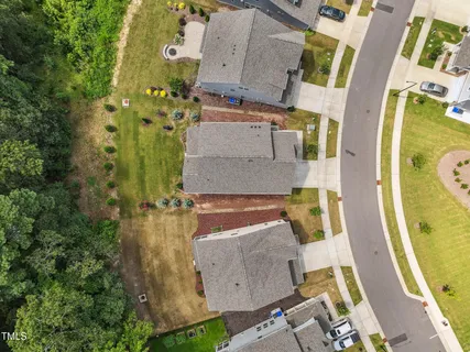 an aerial view of a house with outdoor space swimming pool and mountains