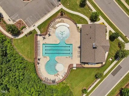 an aerial view of a house with a swimming pool