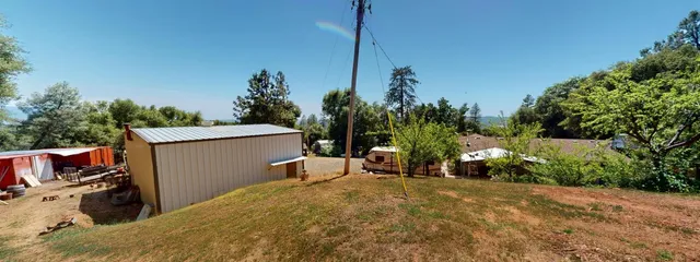a view of a backyard with chairs