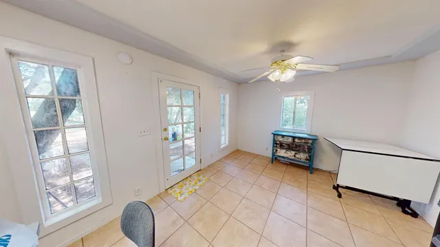 a view of room with furniture and a window