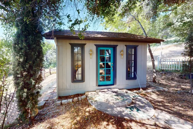 a front view of a house with garden