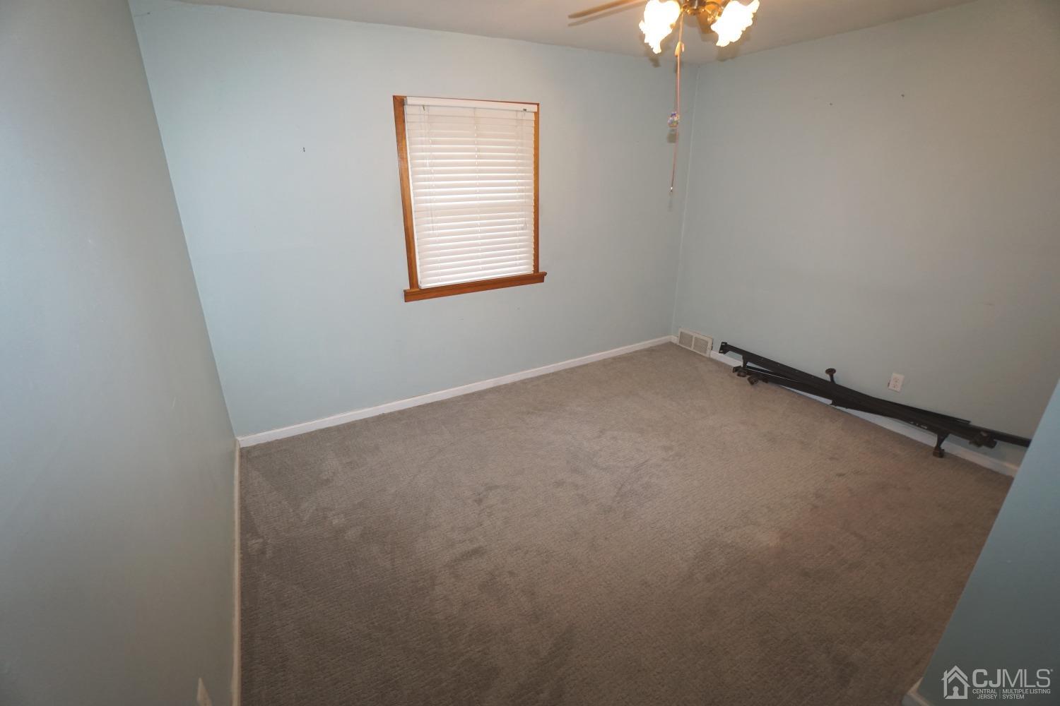 4 Piedmont Road Edison, NJ 08817 - Photo 14 of 22 an empty room with a window