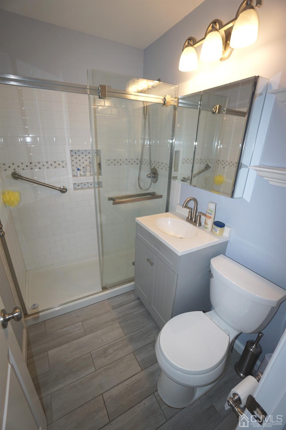 4 Piedmont Road Edison, NJ 08817 - Photo 18 of 22 a bathroom with a toilet sink and shower