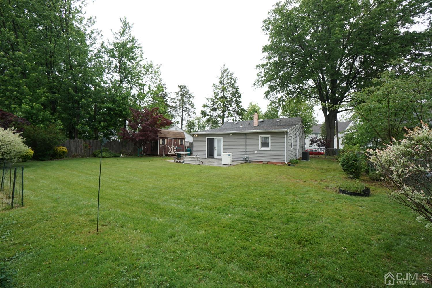 4 Piedmont Road Edison, NJ 08817 - Photo 19 of 22 a view of a house with a yard and sitting area
