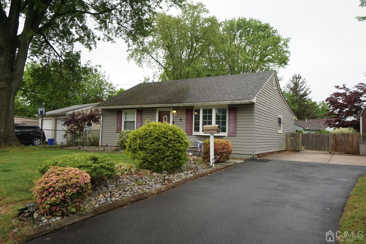 4 Piedmont Road Edison, NJ 08817 - Photo 3 of 22 a view of a house with a garden and yard