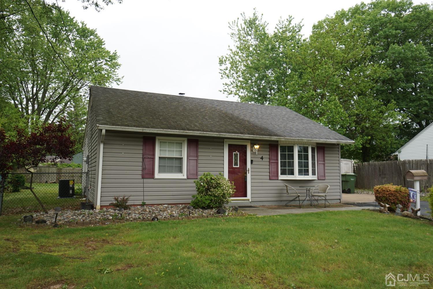 4 Piedmont Road Edison, NJ 08817 - Photo 4 of 22 a front view of a house with a garden