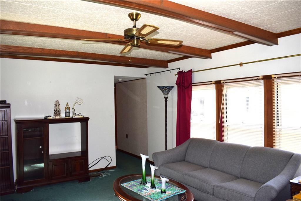 239 Crystal Spring Road Sandy Lake, PA 16145 - Photo 14 of 40 a living room with furniture and a window