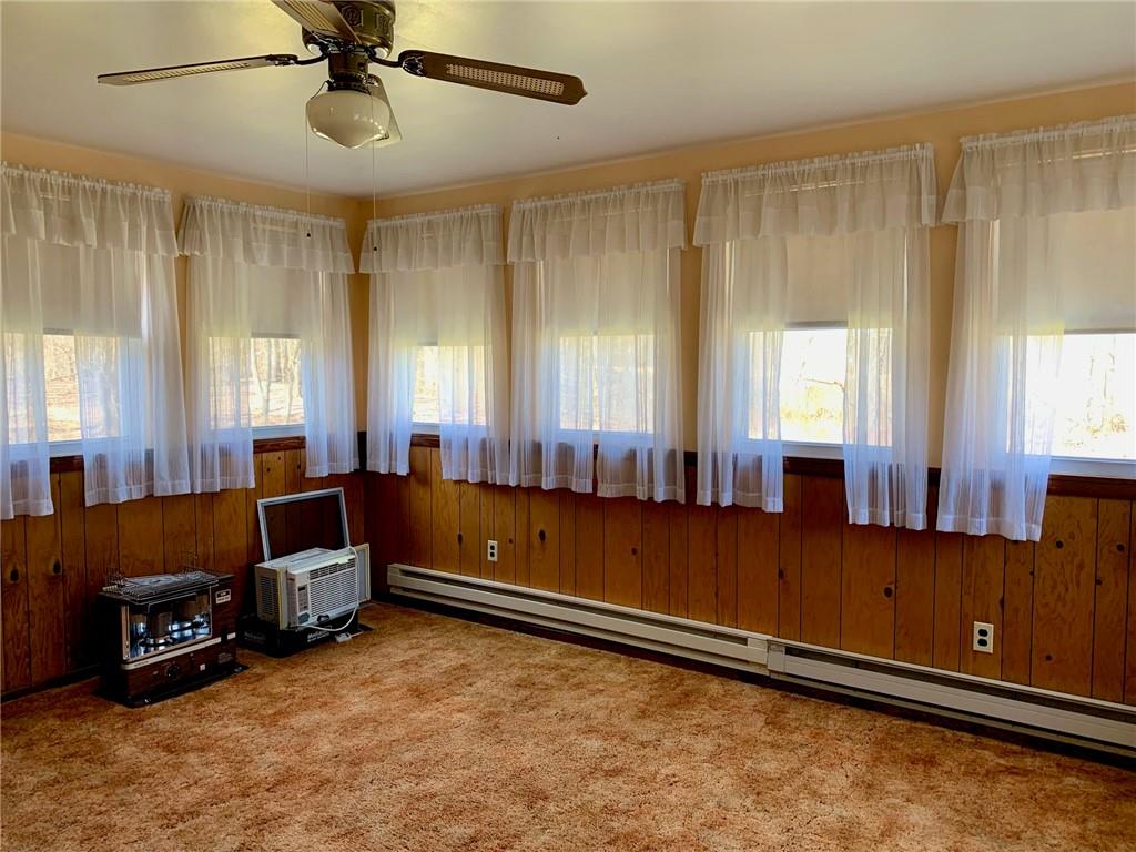 239 Crystal Spring Road Sandy Lake, PA 16145 - Photo 18 of 40 a room with furniture and a window