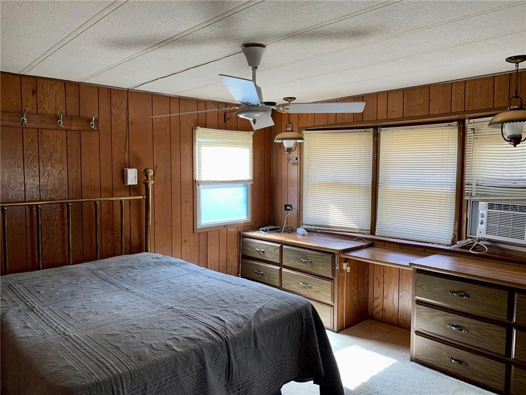 239 Crystal Spring Road Sandy Lake, PA 16145 - Photo 19 of 40 a bedroom with a bed and a window