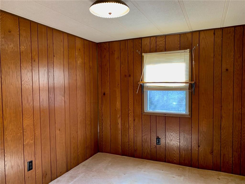 239 Crystal Spring Road Sandy Lake, PA 16145 - Photo 20 of 40 a view of an entryway with wooden wall