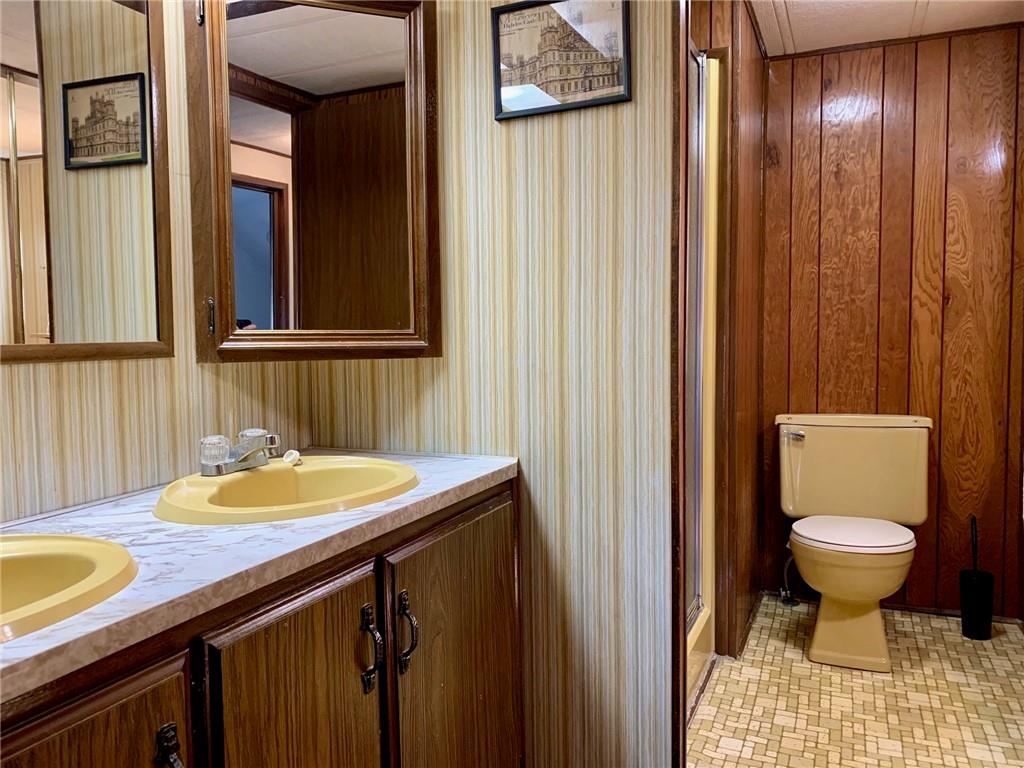 239 Crystal Spring Road Sandy Lake, PA 16145 - Photo 22 of 40 a bathroom with a sink and a toilet