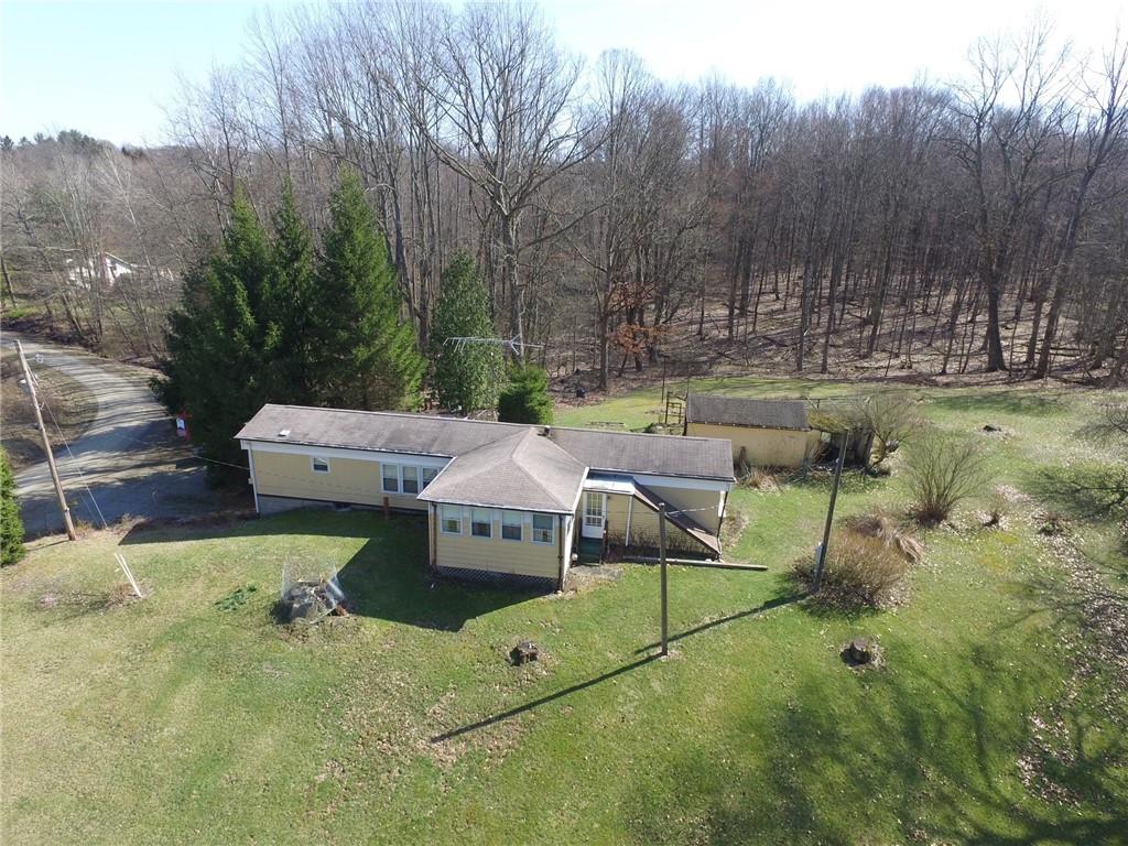 239 Crystal Spring Road Sandy Lake, PA 16145 - Photo 39 of 40 a view of a house with backyard and sitting area