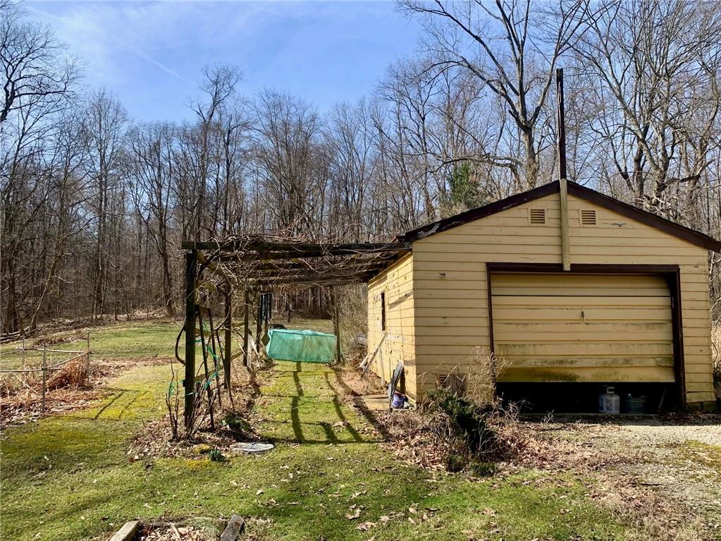 239 Crystal Spring Road Sandy Lake, PA 16145 - Photo 7 of 40 a view of a back yard of the house
