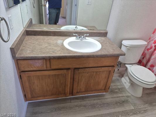 7255 West Sunset Road, Unit 2164 Las Vegas, NV 89113 - Photo 4 of 16 Functional vanity cabinets pair with textured flooring in this secondary bathroom.