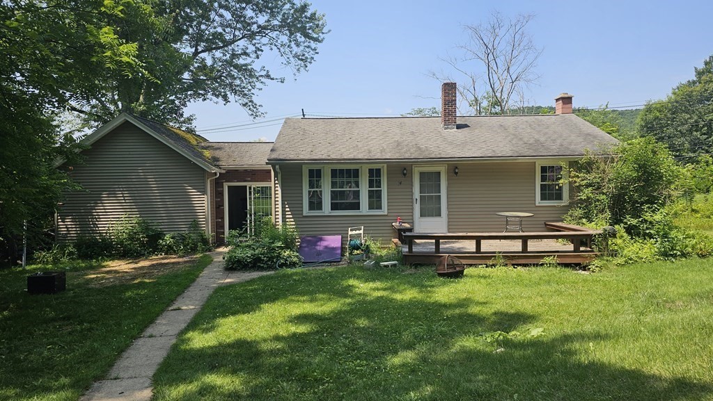 34 High Road Hardwick, MA 01031 - Photo 1 of 29 a front view of house with a garden and patio