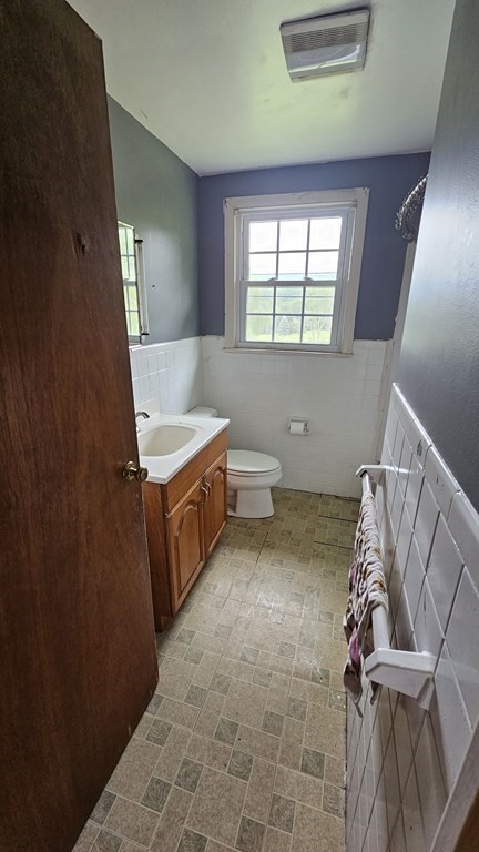 34 High Road Hardwick, MA 01031 - Photo 14 of 29 a bathroom with a sink a toilet and window