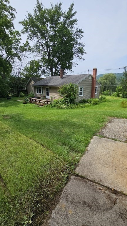 34 High Road Hardwick, MA 01031 - Photo 29 of 29 a front view of a house with garden