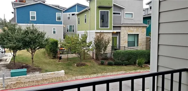 a view of a backyard with swimming pool