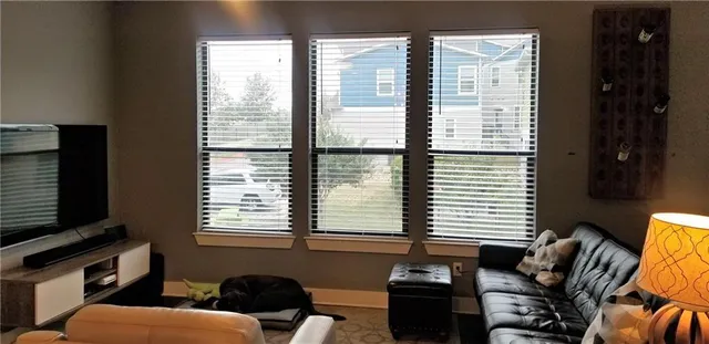 a room with furniture and a flat screen tv