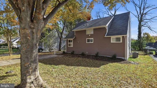 a backyard of a house with yard and outdoor seating