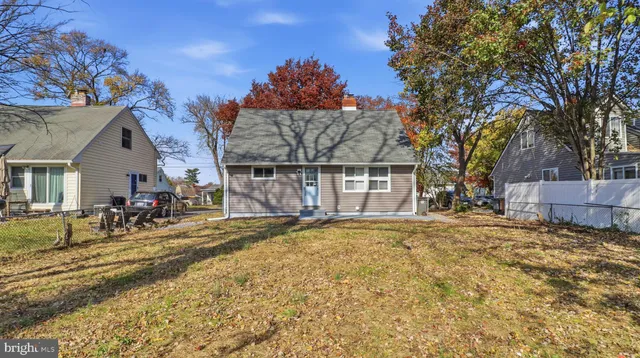 a view of a house with snow on the side of the road