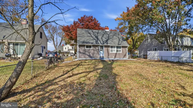 a view of yard covered with snow in front of house