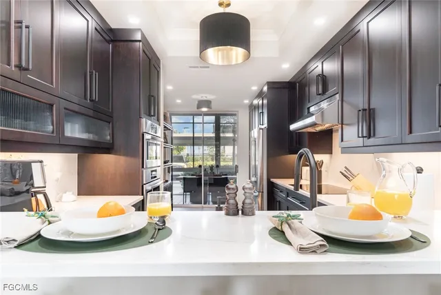 a kitchen with a sink and natural light