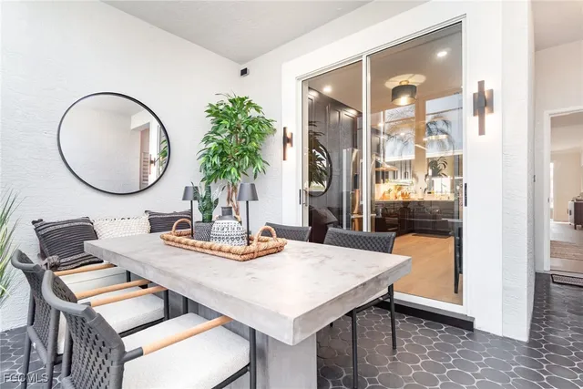a dining room with furniture and wooden floor