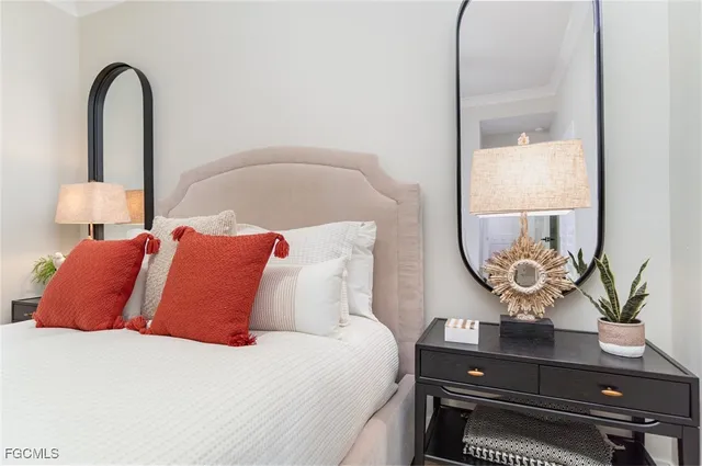 a bedroom with bed and a window