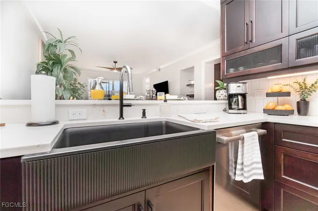 a kitchen with a sink and a refrigerator