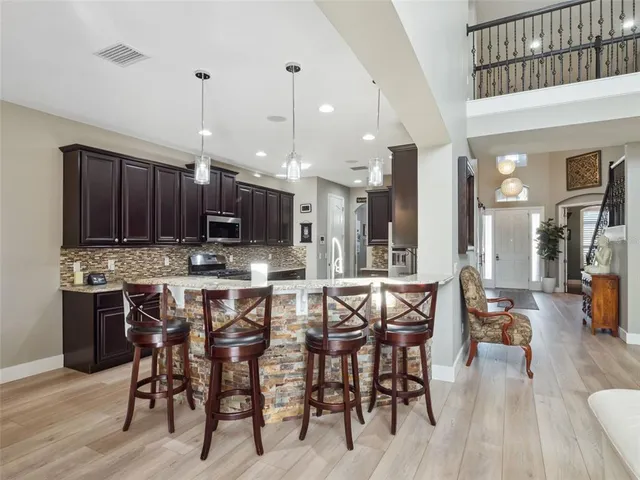 a spacious bedroom with a large bed and a couch