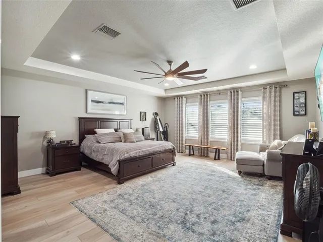 a bathroom with a window and a mirror