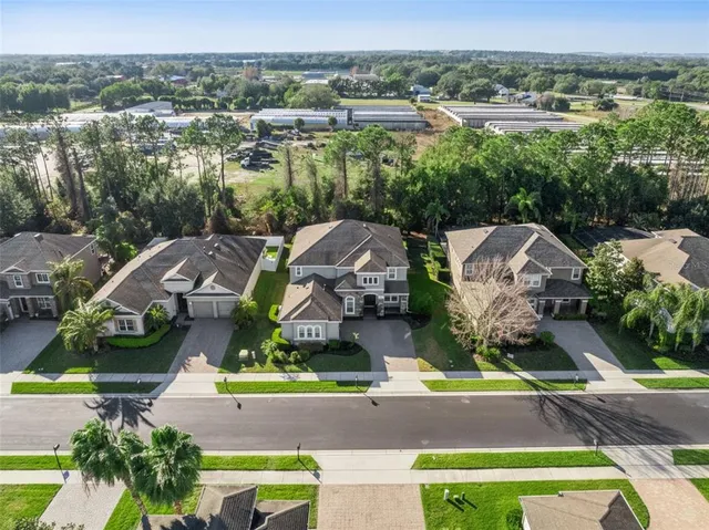 a view of a swimming pool with outdoor seating
