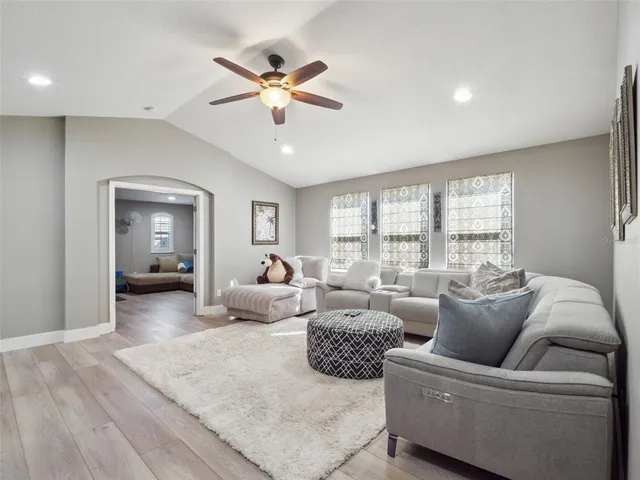 a living room with furniture and a window