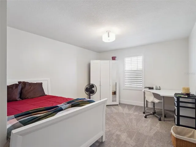 an aerial view of a house with a garden