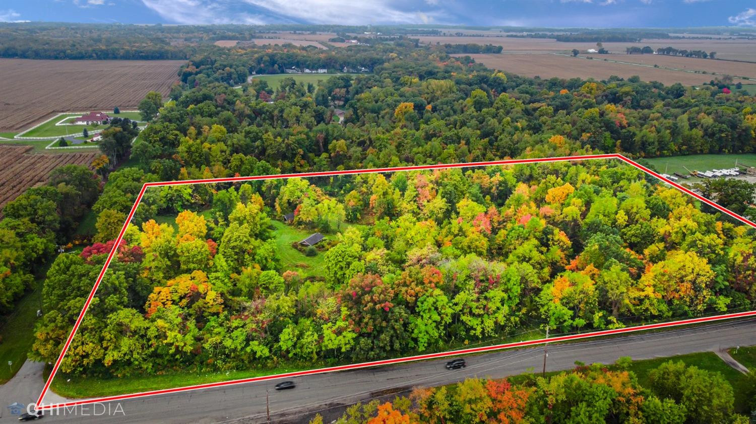 260 Hupp Road La Porte, IN 46350 - Photo 7 of 12 a view of a green field with a lake view