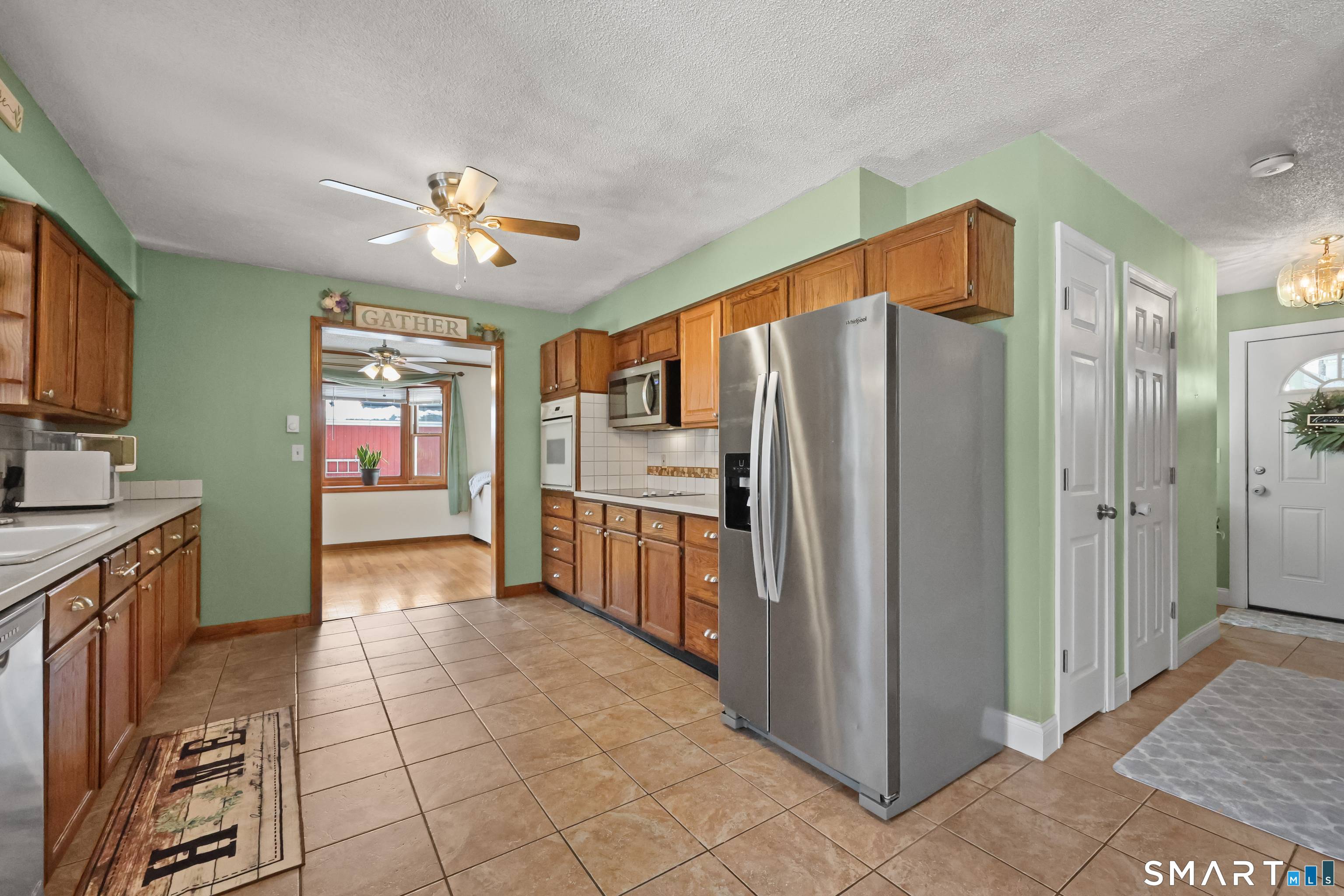 13 Basket Shop Road Hebron, CT 06248 - Photo 12 of 38 a kitchen with stainless steel appliances a refrigerator and a stove top oven