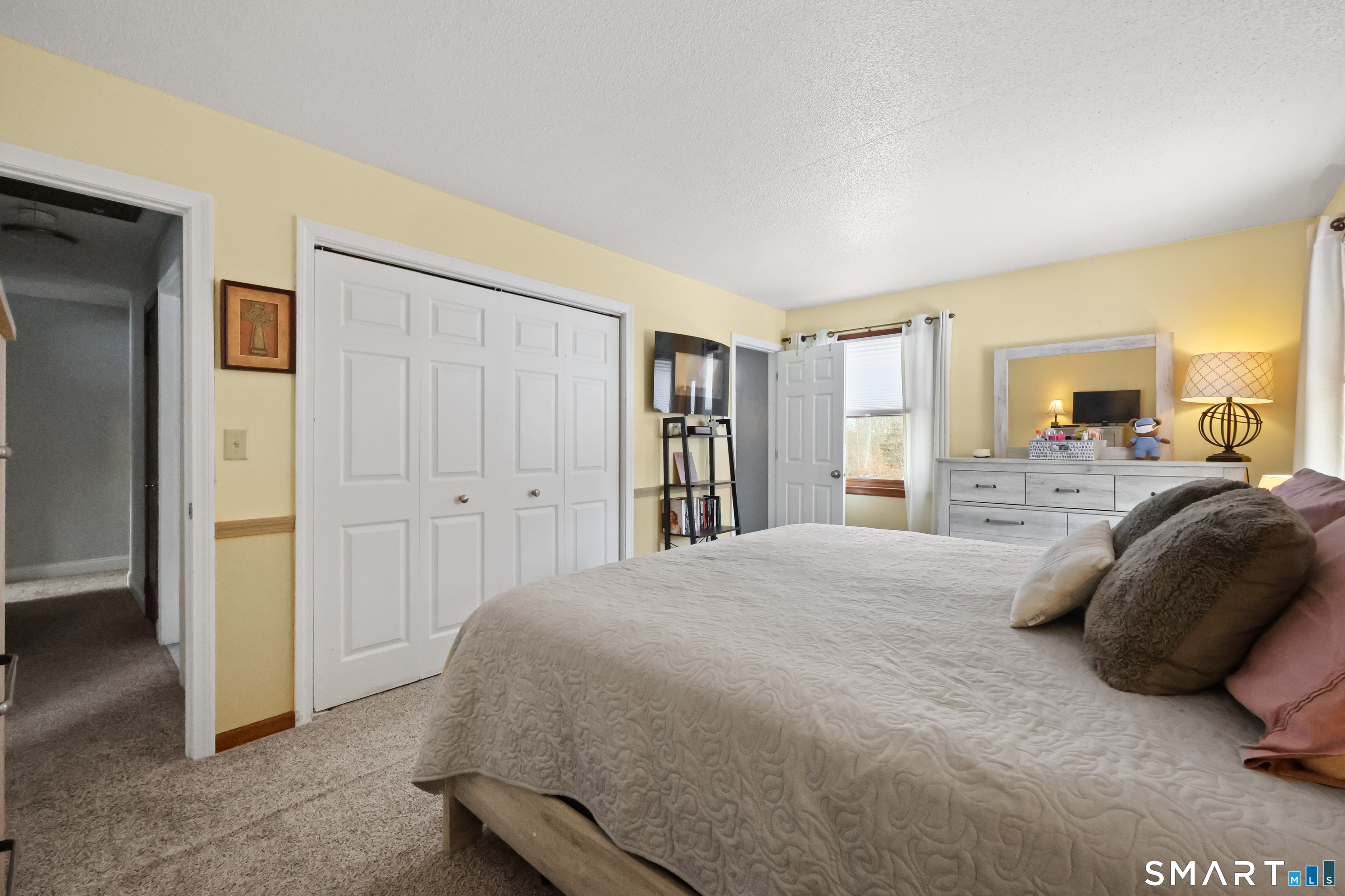 13 Basket Shop Road Hebron, CT 06248 - Photo 24 of 38 a bedroom with a large bed and a large closet