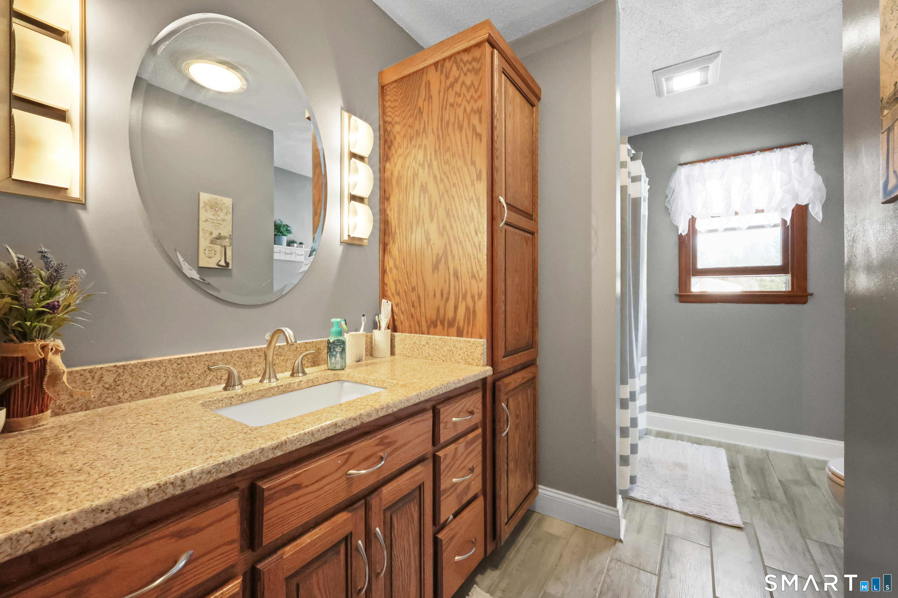 13 Basket Shop Road Hebron, CT 06248 - Photo 25 of 38 a bathroom with a granite countertop sink and a mirror