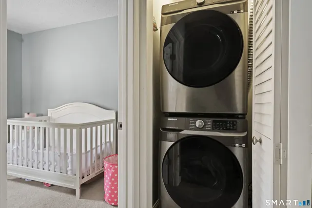 a view of a livingroom with workspace and a window