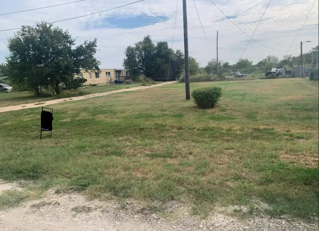 a fire hydrant in the middle of a field