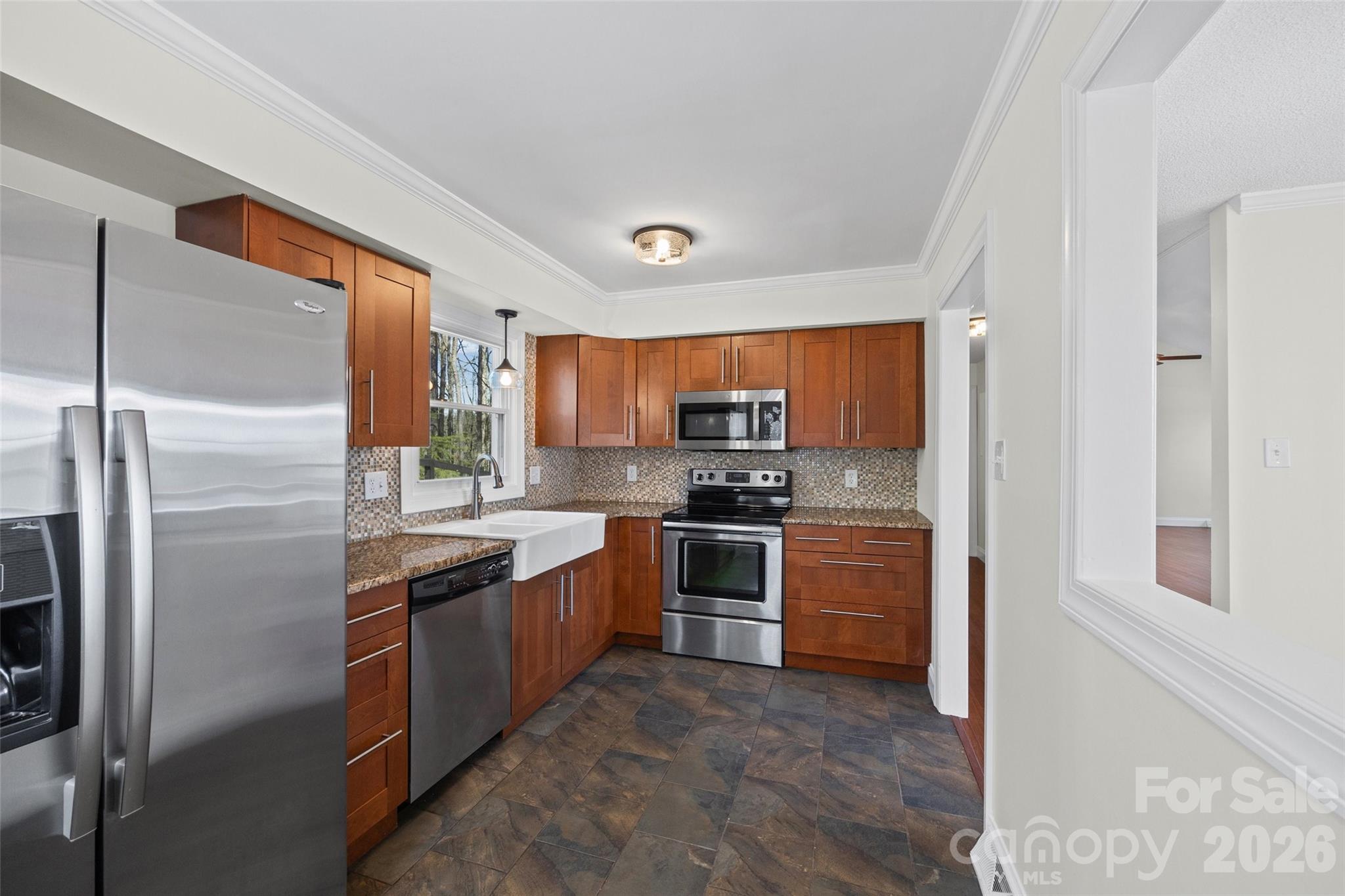 16149 Haroa Court Fort Mill, SC 29708 - Photo 14 of 43 a kitchen with stainless steel appliances granite countertop a refrigerator a stove top oven a sink and dishwasher