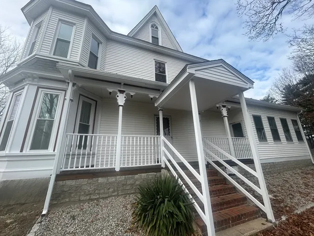 a front view of a house with stairs