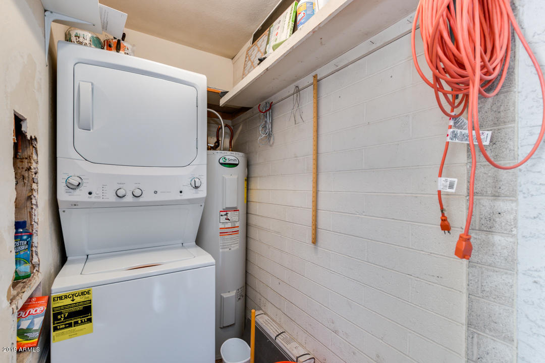 1250 East Bethany Home Road, Unit 24 Phoenix, AZ 85014 - Photo 12 of 19 a utility room with dryer and washer
