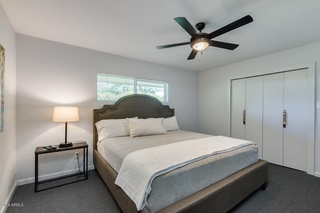 1250 East Bethany Home Road, Unit 24 Phoenix, AZ 85014 - Photo 5 of 19 a bedroom with a bed and closet