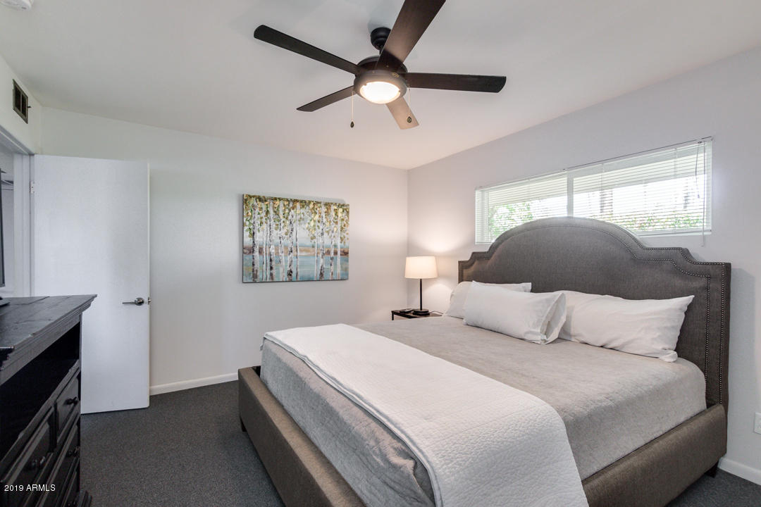1250 East Bethany Home Road, Unit 24 Phoenix, AZ 85014 - Photo 6 of 19 a bedroom with a bed and a window