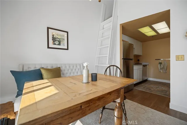 a bedroom with a bed and a mirror