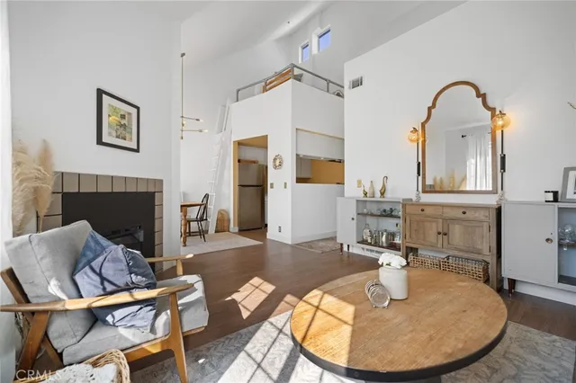 a view of a livingroom with furniture and a fireplace